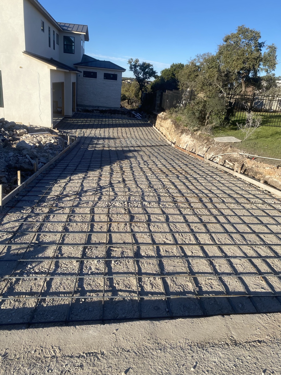 Driveway prep with rebar grid before the concrete pour